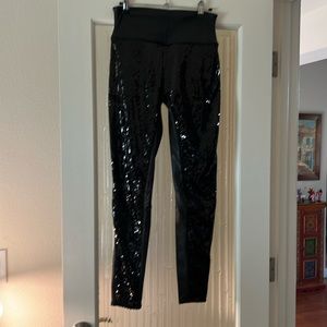Spanx faux leather with sequence on the front all the way down the leg.